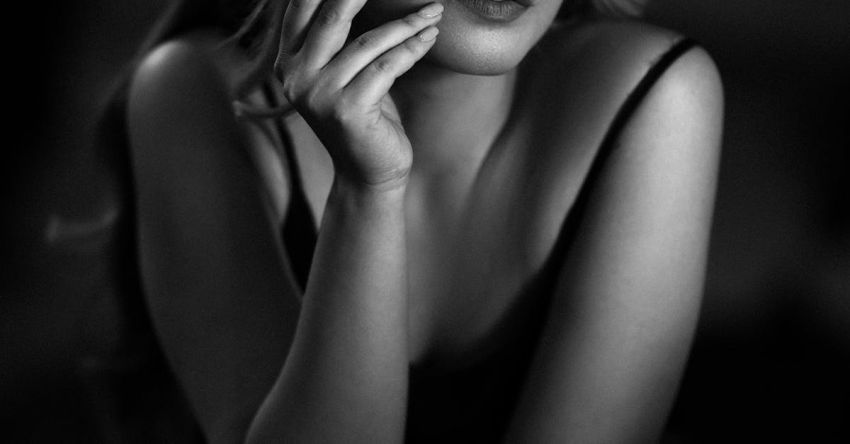 Societies - Black and White Photography of a Young Woman Smoking a Cigarette